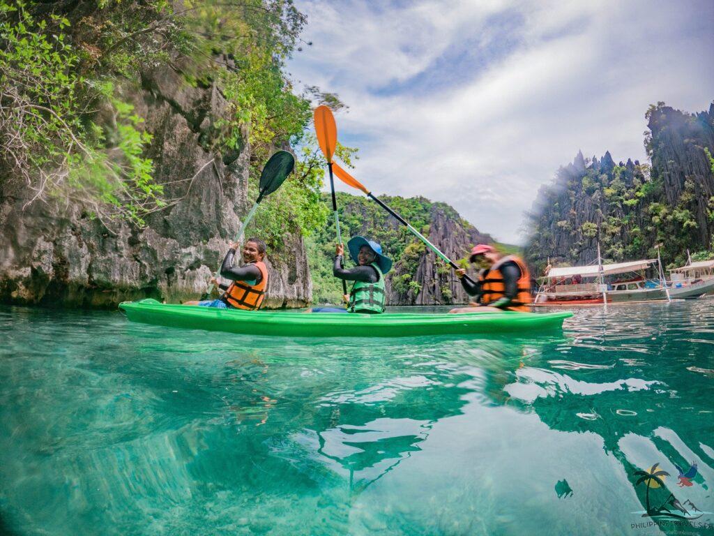 Three people riding kayak in twin lagoon