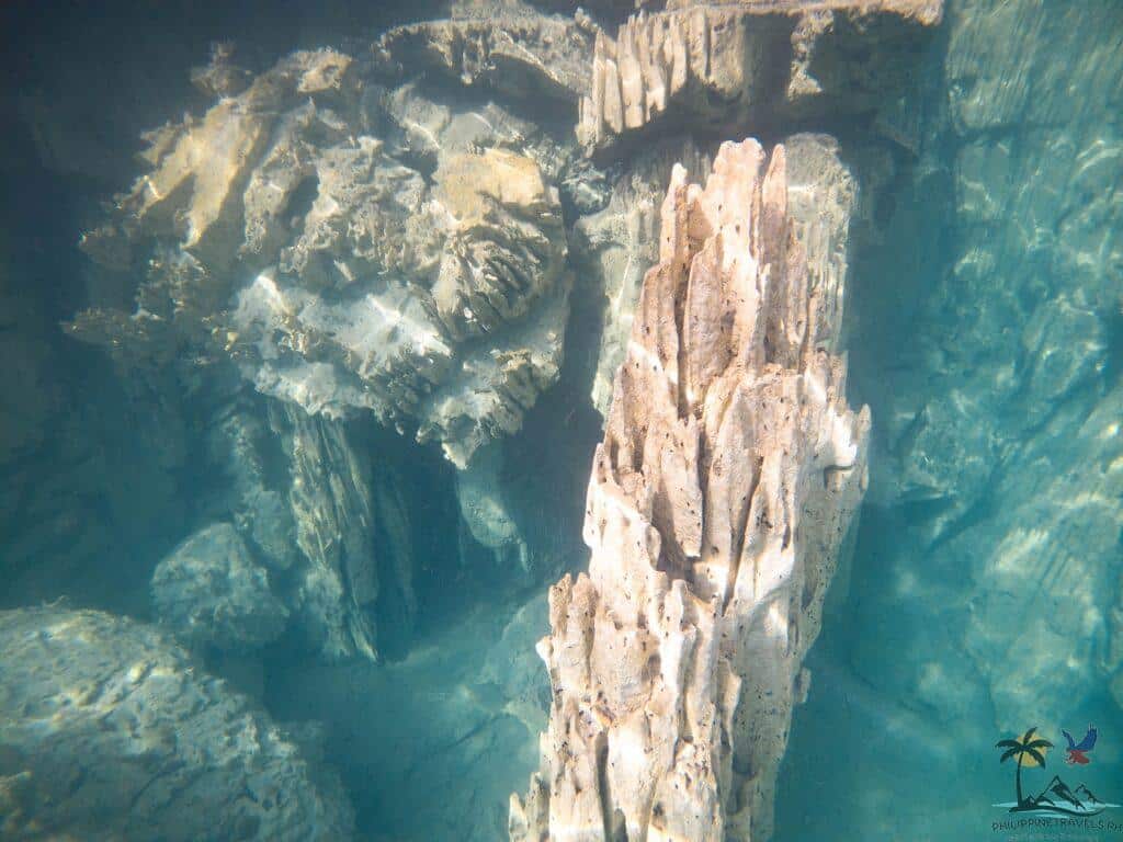 Underwater rock formations in Kayangan lake