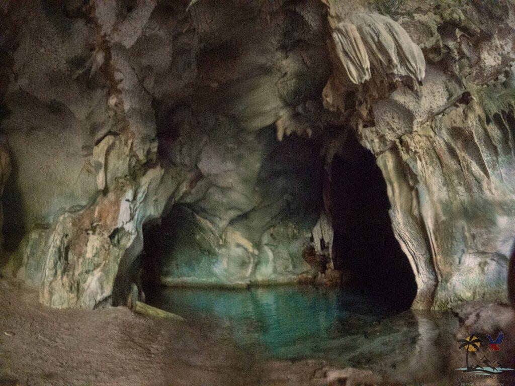 Natural pool inside black island cave