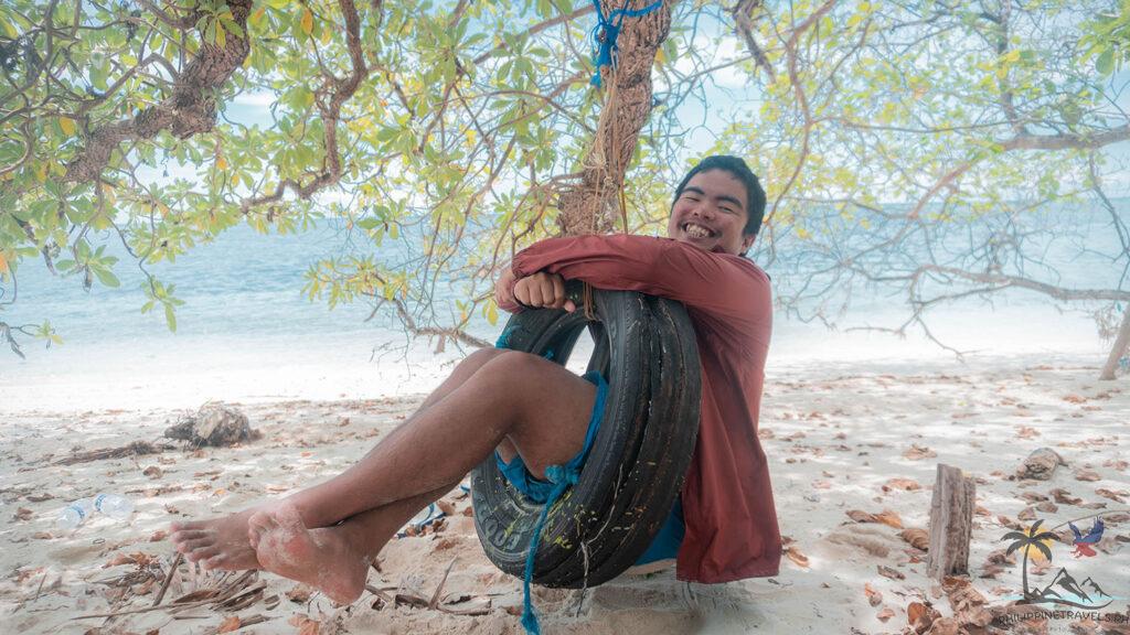 Me in a tire swing in Mantigue beach