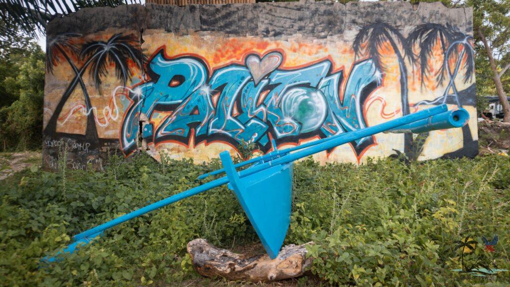 Fishing boat in front of Paliton graffiti