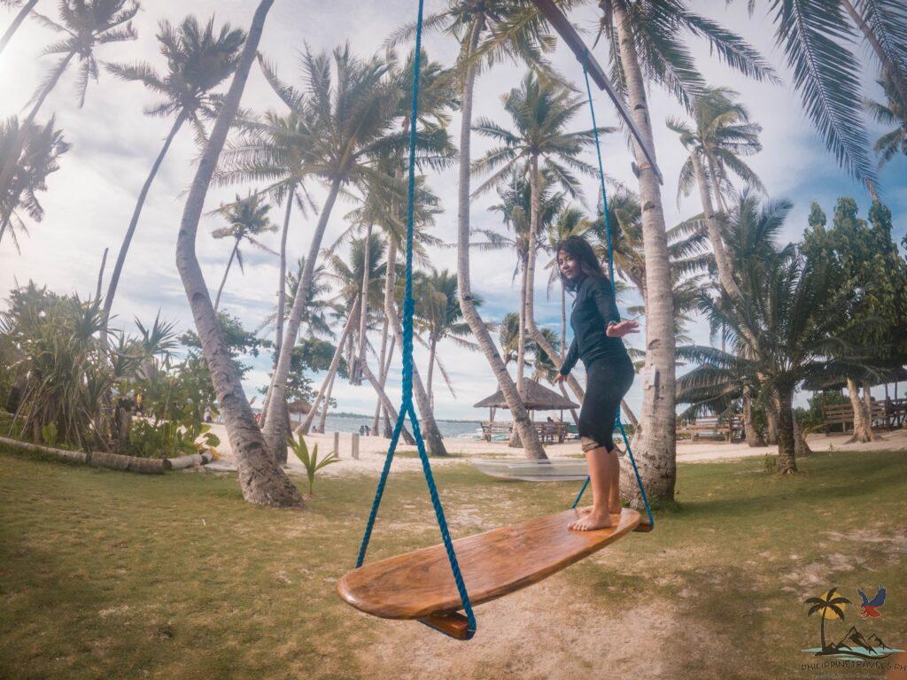 Person balancing in surf swing