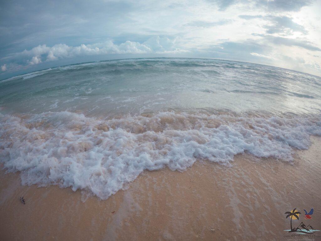 Waves crashing in Tubod Beach