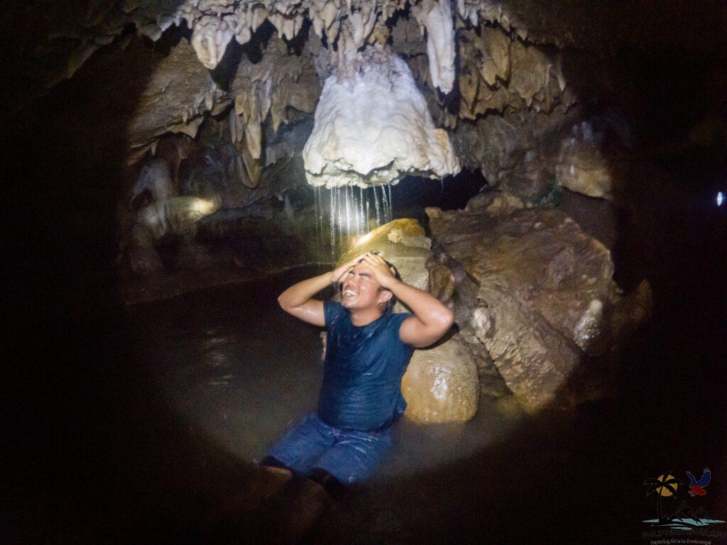 Me taking a shower with the shower head formation inside cantabon cave