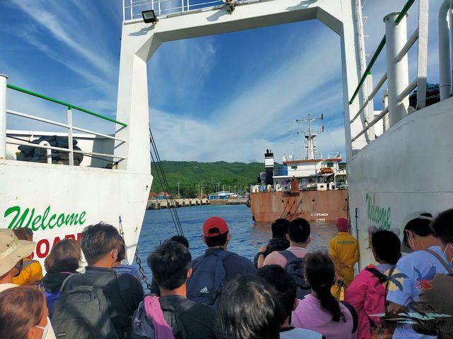 People waiting at the exit of the boat