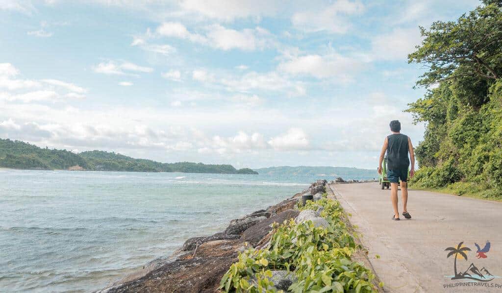 Man walking in ilig ilagan beach
