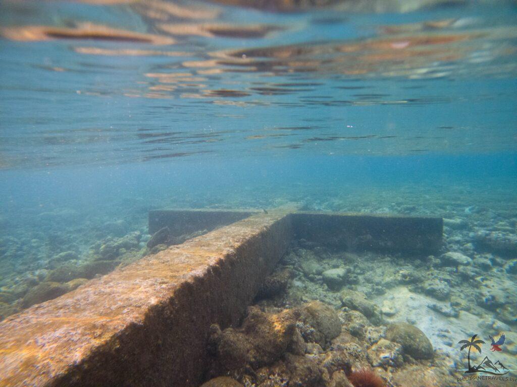 Old cross in sunken cemetery