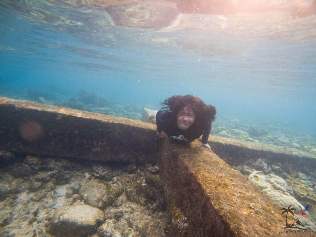 Person on the sunken cemetery cross