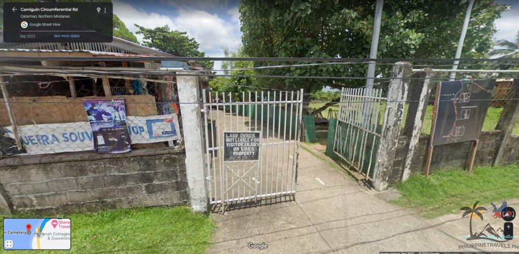 Street view look of the entrance to sunken cemetery