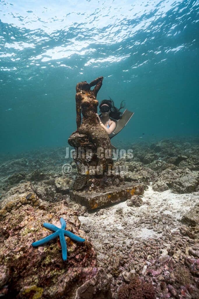 Mermaid statue in Moalboal