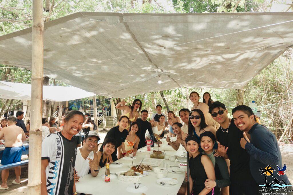 People smiling in Apo Reef